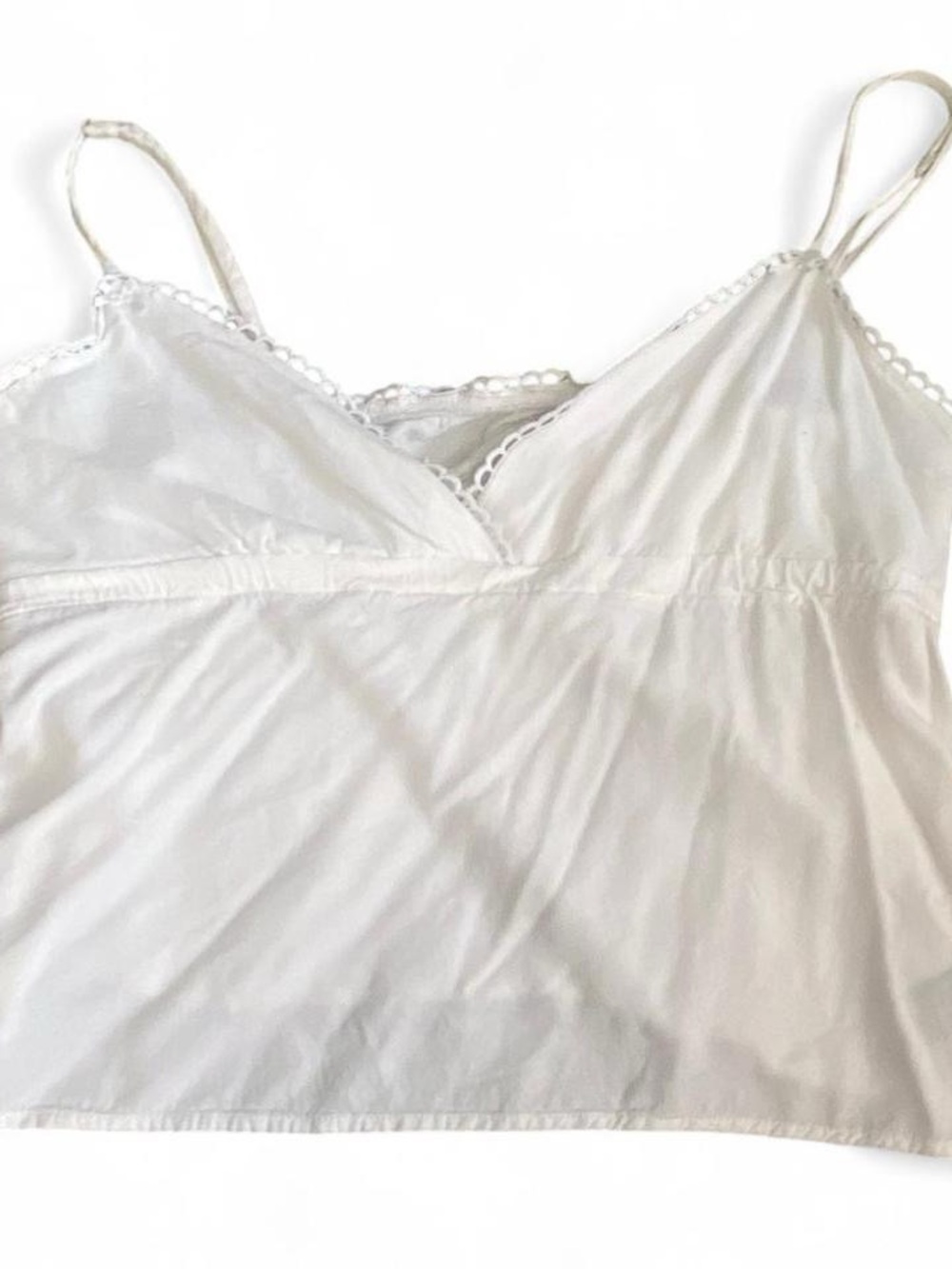 White lace trim baby doll cami top with adjustable straps. Size Small